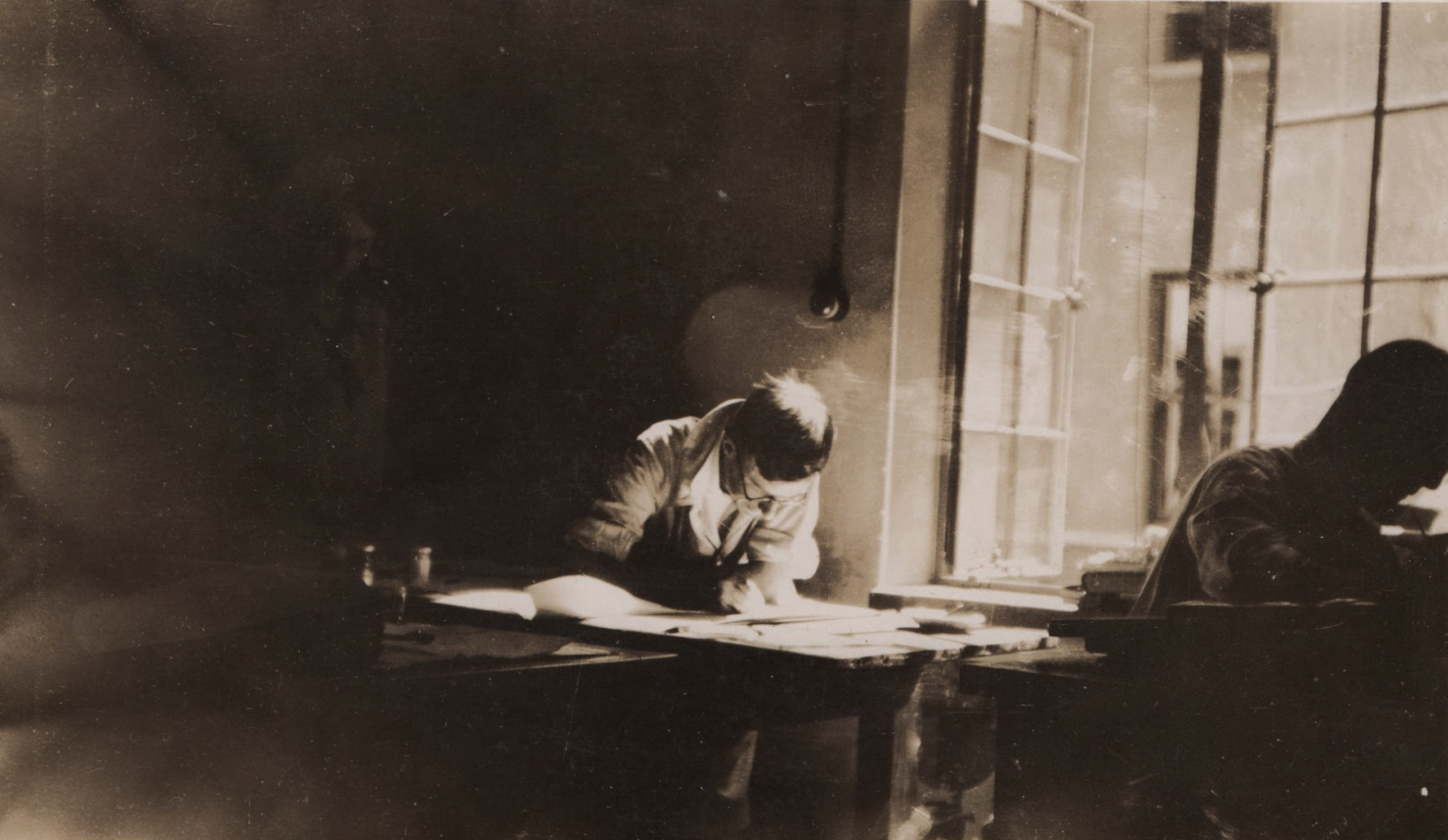 #1920_7_Stuart drawing at his desk