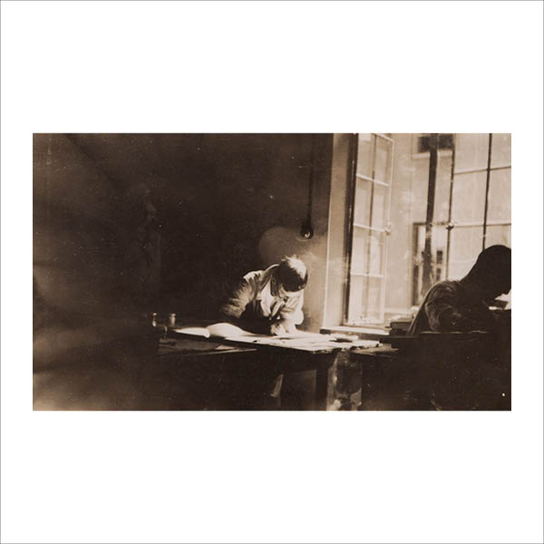 Stuart drawing at his desk